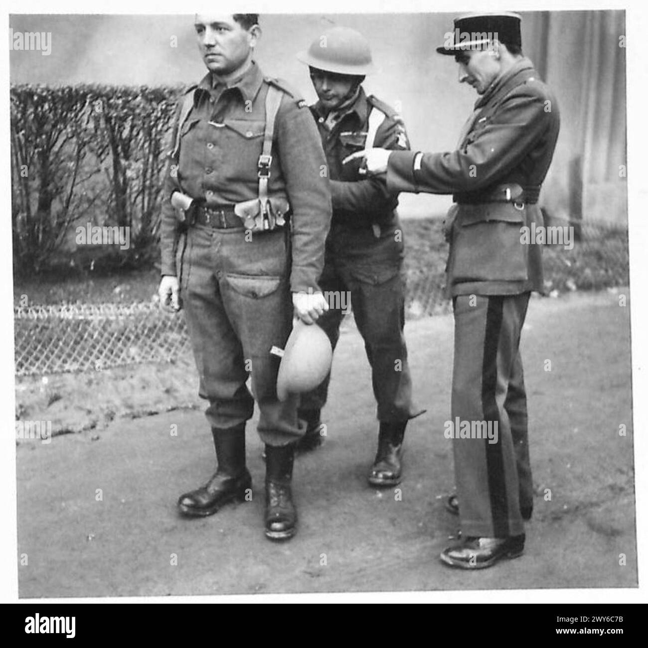 Uniform Issue A French officer inspects his troops to ensure proper issue of British ...