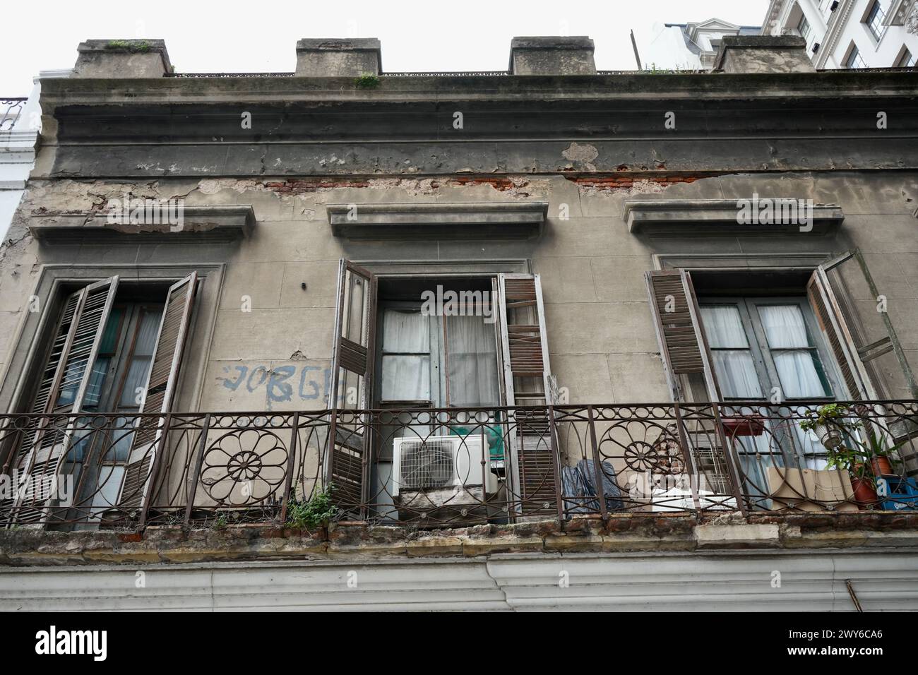 A rustic faded balcony on a colonial building Stock Photo - Alamy