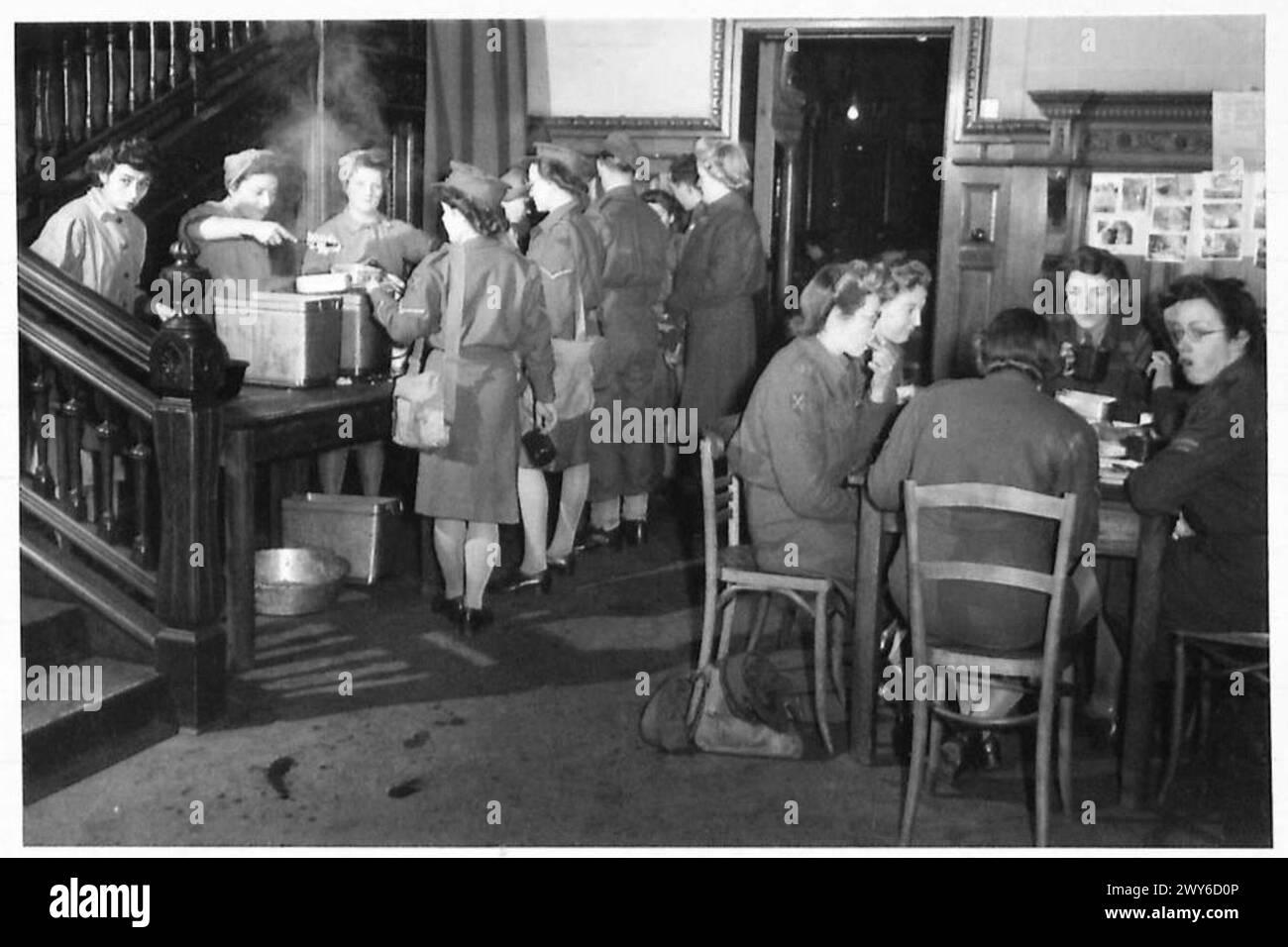 A.T.S. IN BRUSSELS - The Lunch Hour in a Former Gestapo HQ. , British Army, 21st Army Group Stock Photo