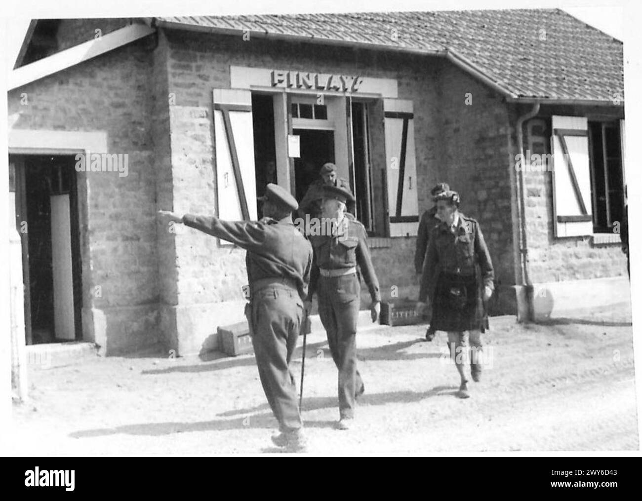 (8) CORPS REST CAMP - General Sir Ronald Adam, accompanied by other Senior Officers, coming out of Finlay's (NAAFI) shop. , British Army, 21st Army Group Stock Photo