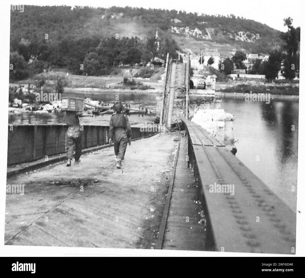 British Army soldiers carry rations while following up an assault party ...