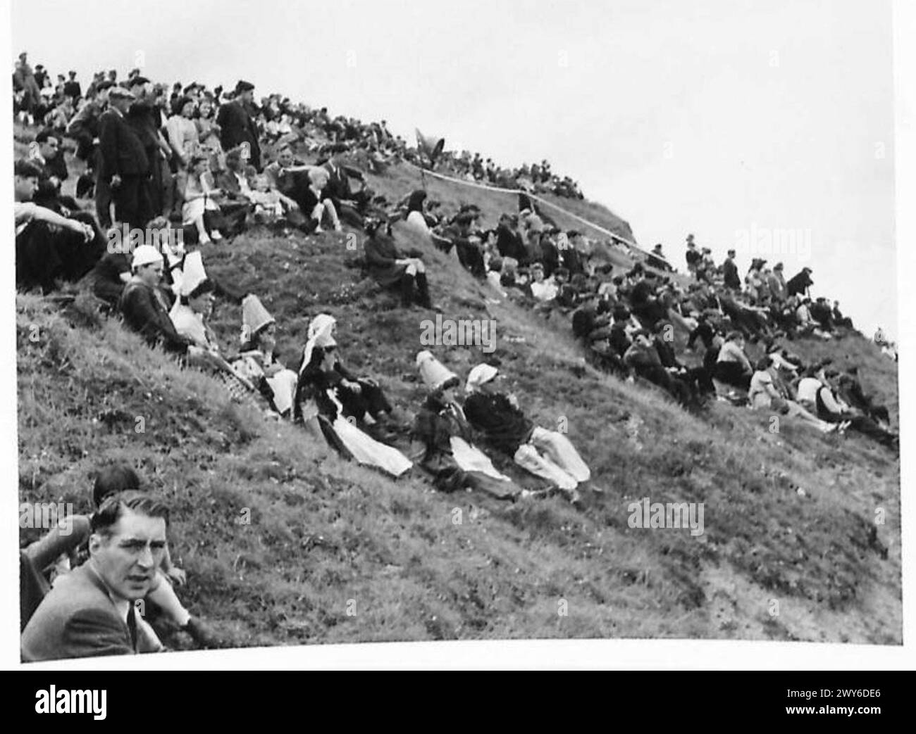 "DDAY" ANNIVERSARY CEREMONIES ON NORMANDY BEACHES Scenes of the crowds on the cliffs and the