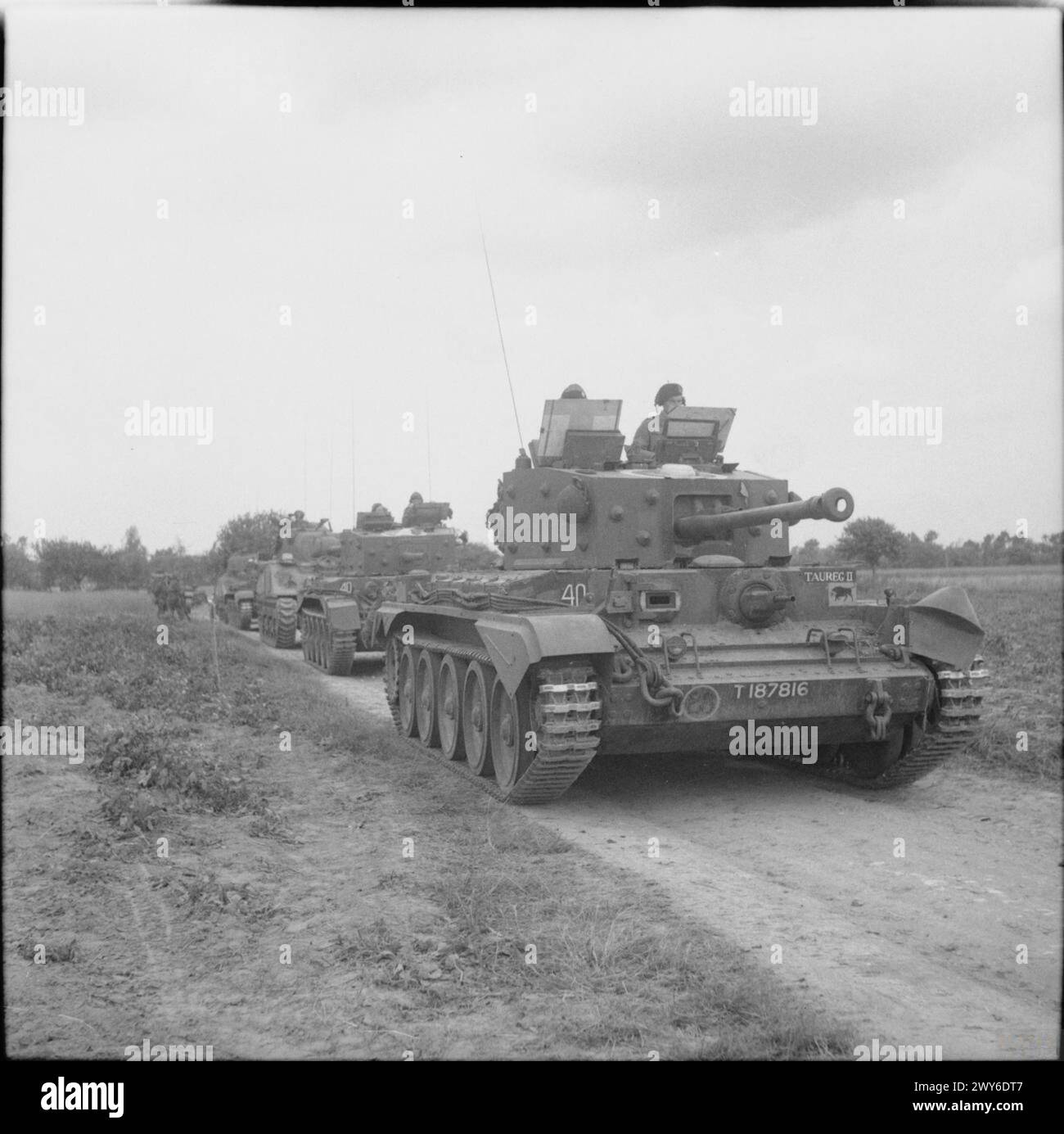THE BRITISH ARMY IN THE NORMANDY CAMPAIGN 1944 - A Cromwell command tank, named 'Taureg II', of 11th Armoured Division HQ leads a Centaur OP tank with dummy gun and two Shermans during Operation 'Epsom', 26 June 1944. , Stock Photo
