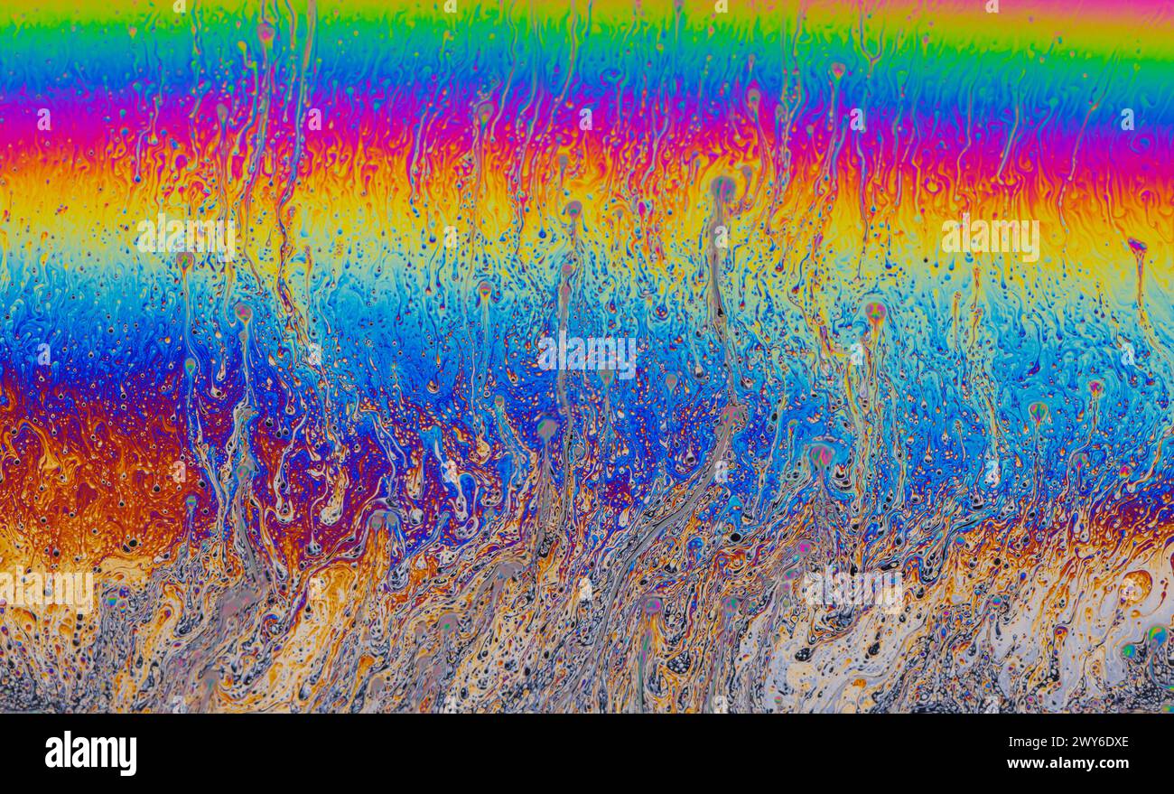 Colorful liquid mixture, blending paints in dynamic abstract fluid ...