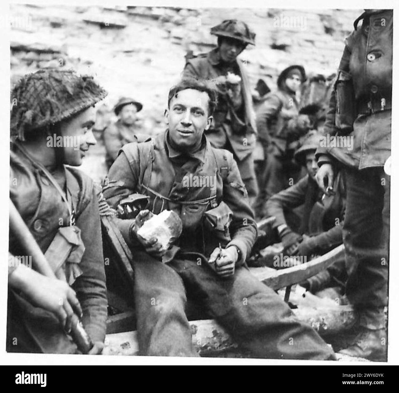 UDEM - His first meal for nearly two days. , British Army, 21st Army Group Stock Photo