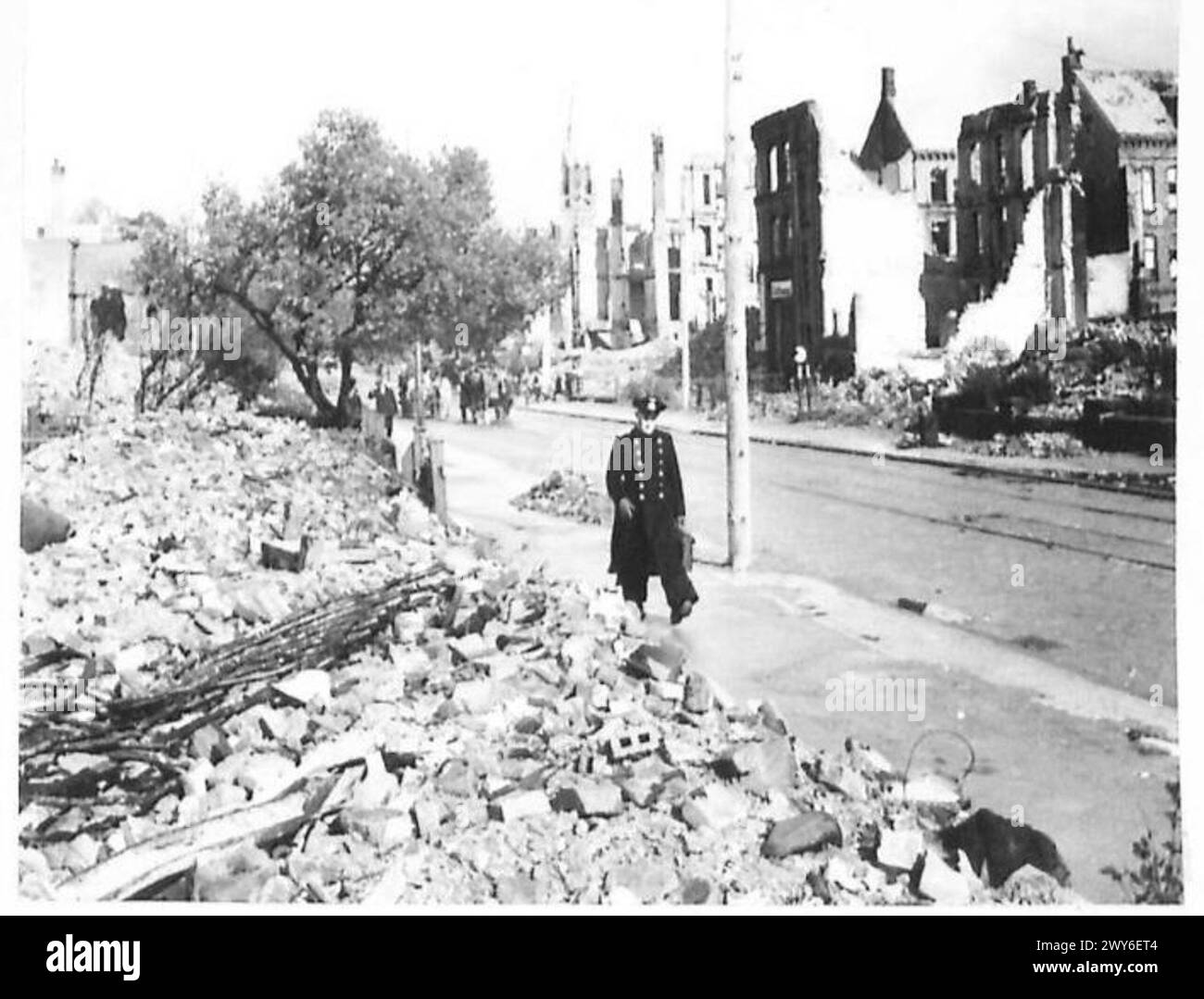 DAMAGE IN KIEL - In the distance a church steeple still standsamidst bombed ruins in Kiel. , British Army, 21st Army Group Stock Photo
