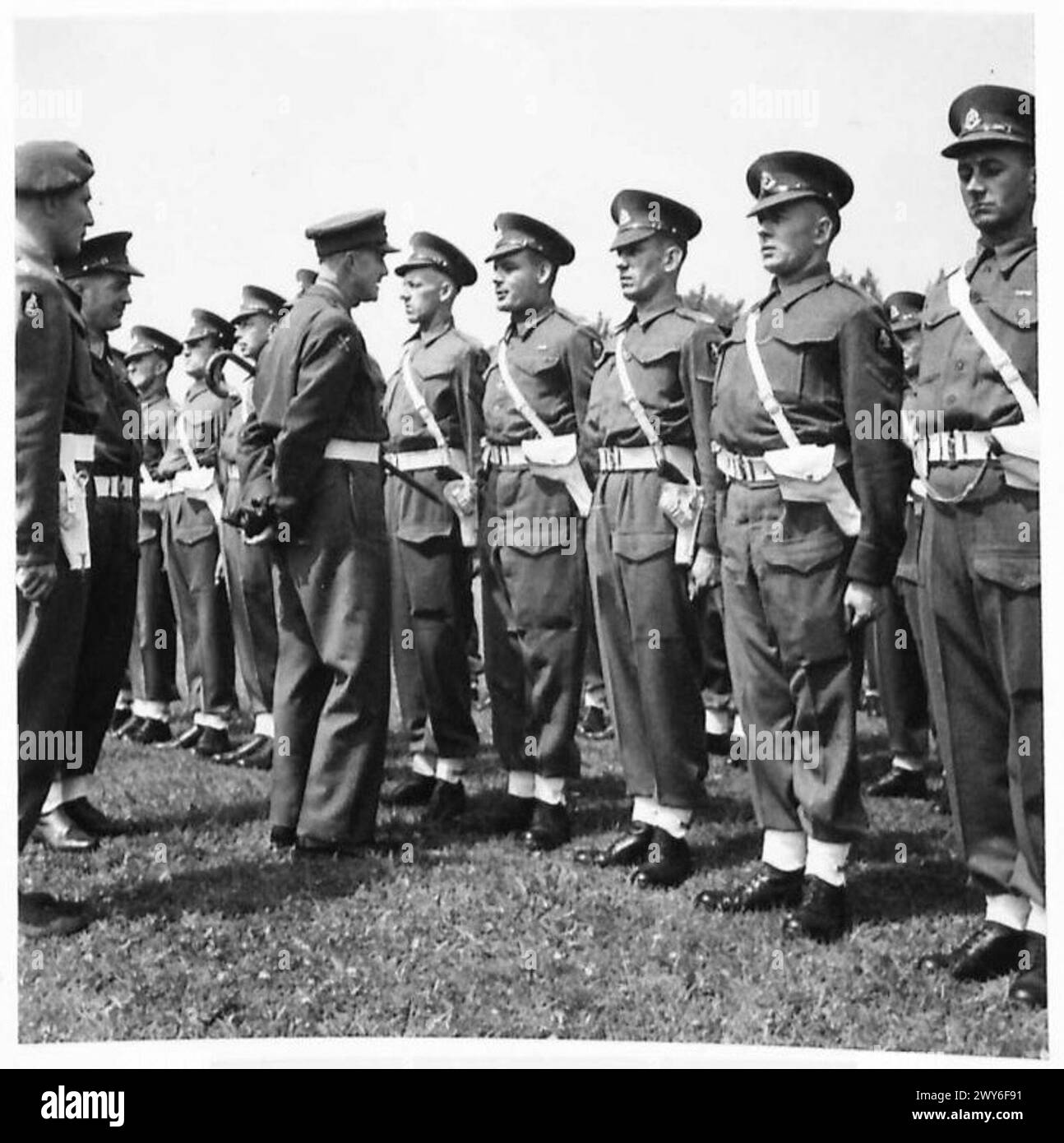 VETERANS OF THE DESERT ON PARADE - Provost Marshal speaking with L/Cpl ...