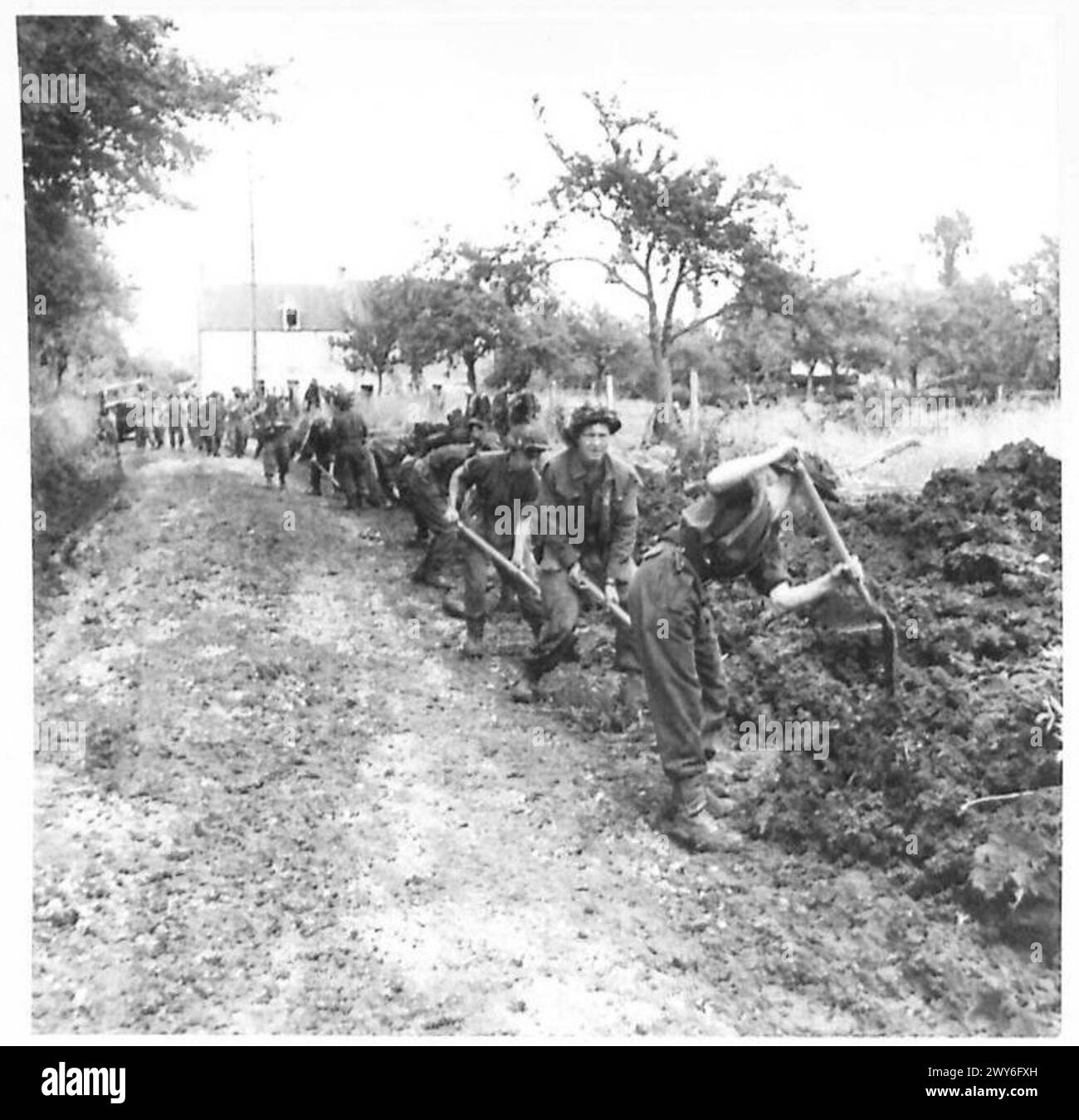 Royal Engineers of 615th Field Squadron work on widening a road in ...