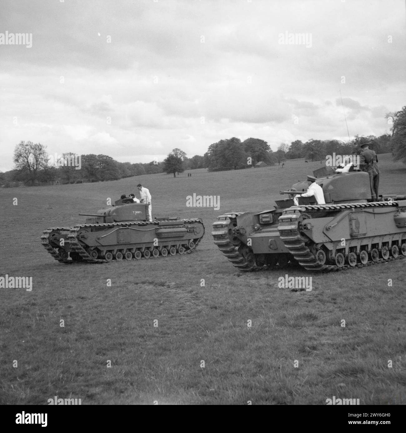 THE BRITISH ARMY IN THE UNITED KINGDOM 1939-45 - Winston Churchill in the turret of a Churchill I tank (nearest camera) during a demonstration of the new vehicle at Vauxhall's at Luton, 23 May 1941. Sir John Dill, Chief of the Imperial General Staff, is in the second vehicle. These were the first two production models of the new tank, named for the Prime Minister. , Churchill, Winston Leonard Spencer Stock Photo