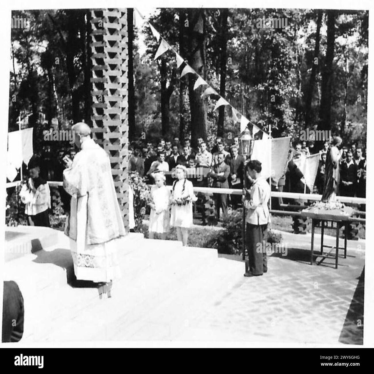 Italian displaced persons conduct an open-air Mass and consecrate a ...