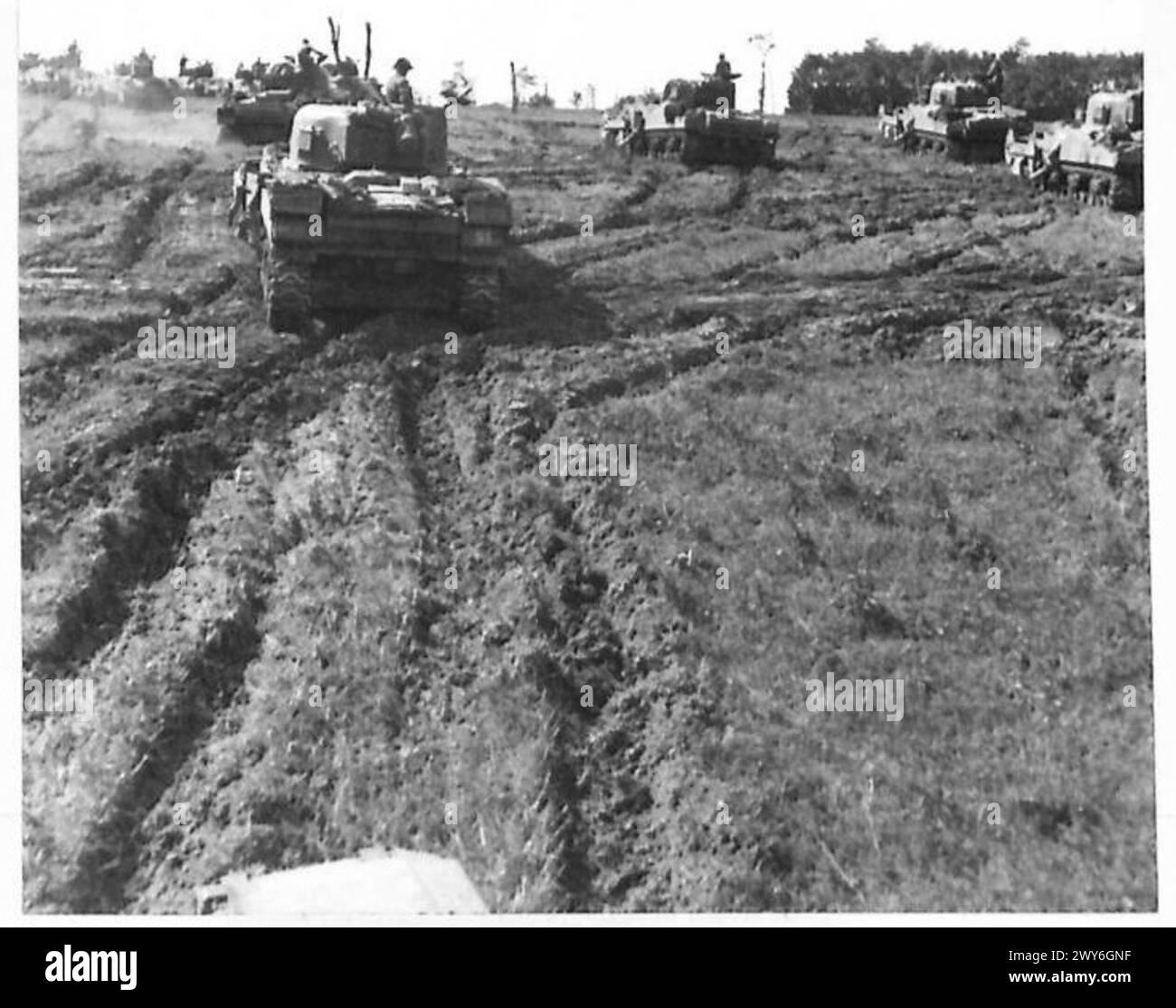BRITISH ADVANCE ON LE HAVRE - Tanks of 34 Tank Bridge moving up behind the crest of a hill on the forming-up-point before going into action. , British Army, 21st Army Group Stock Photo