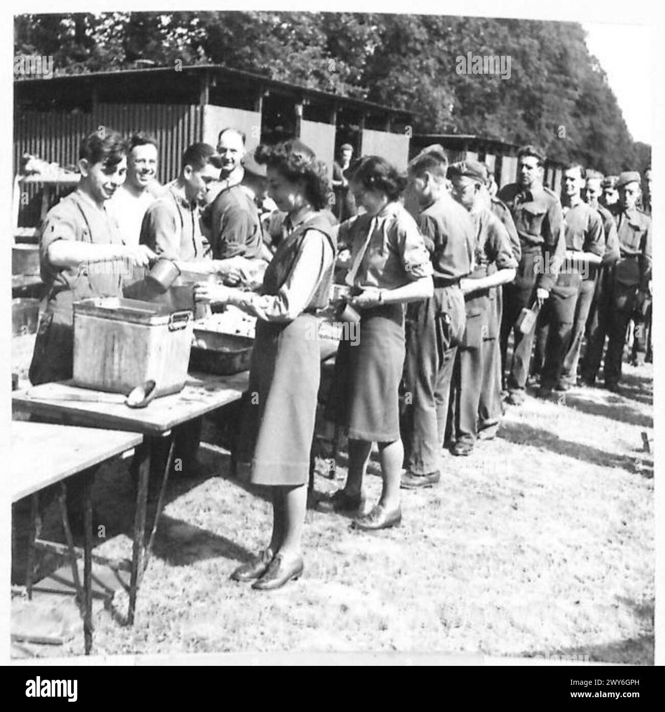 Service Line Up Members of the Auxiliary Territorial Service line up with troops for ...