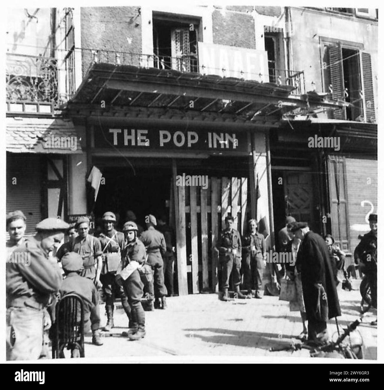 NORMANDY - VARIOUS - Troops are now able to make purchases at the NAAFI in Caen. Here some of them are seen entering The Pop Inn canteen. , British Army, 21st Army Group Stock Photo