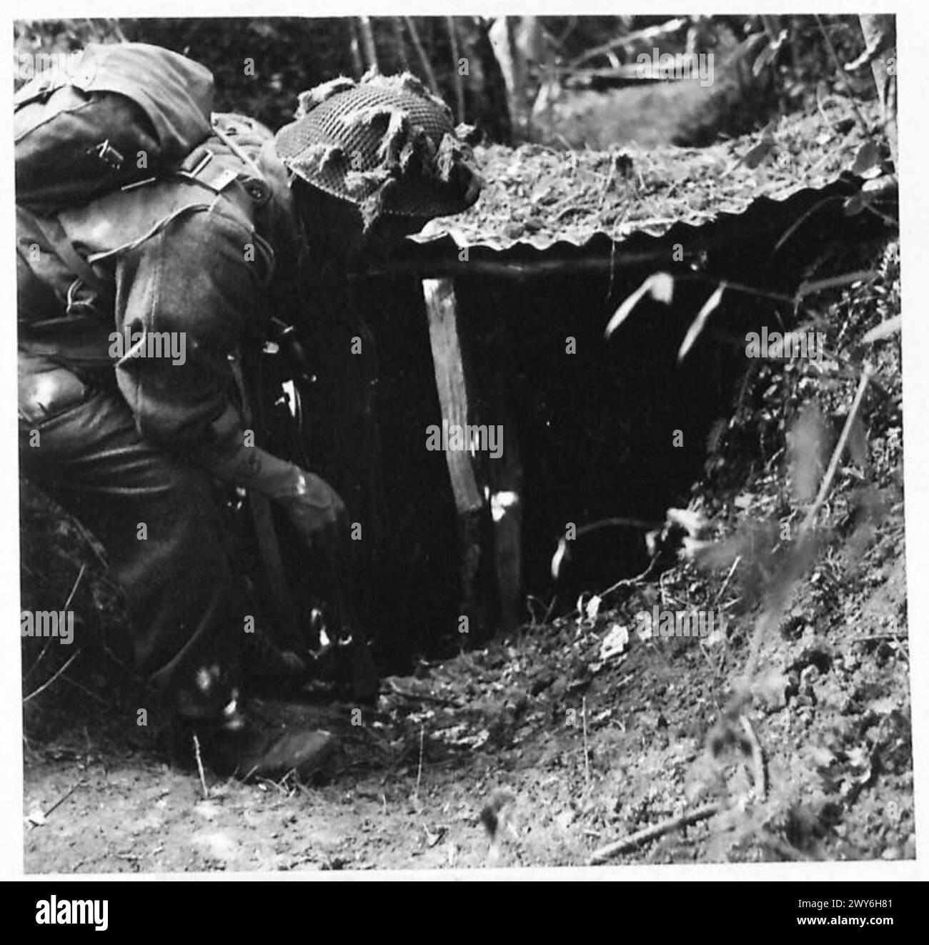An infantryman finds a previously dug slit trench to rest, saving hours ...
