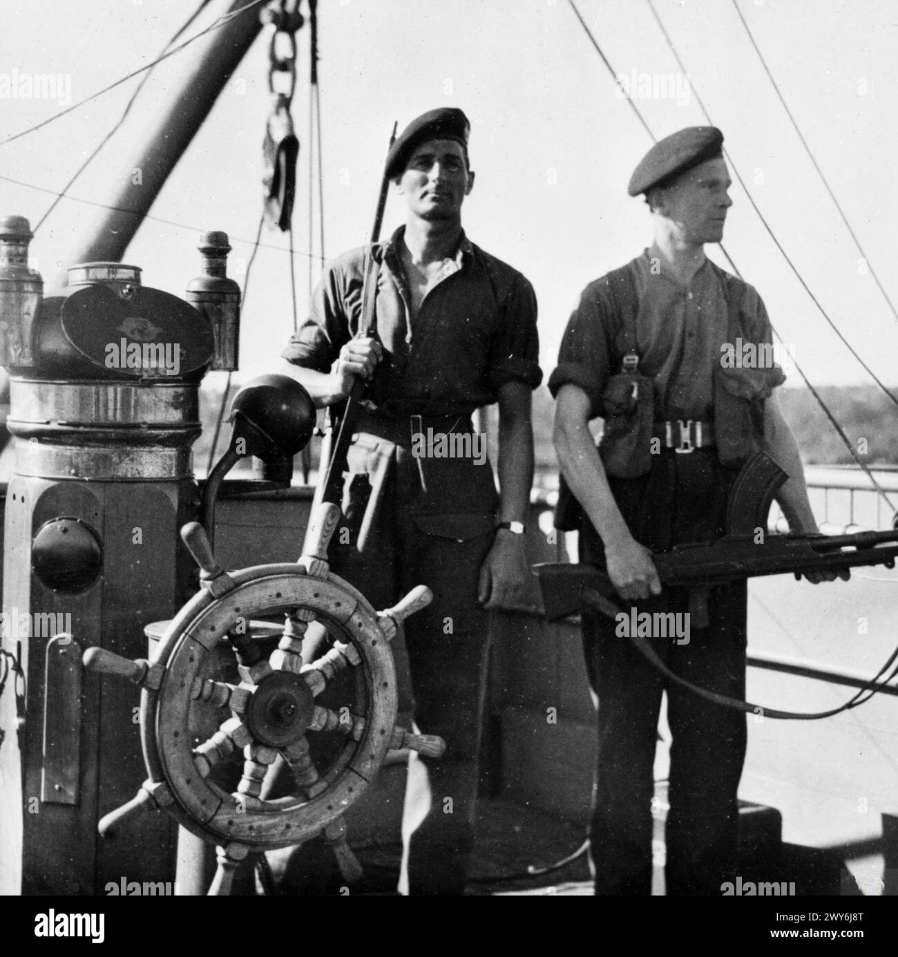 ROYAL MARINES GUARD GERMAN MERCHANT SHIPS. MAY 1945, KIEL, GERMANY