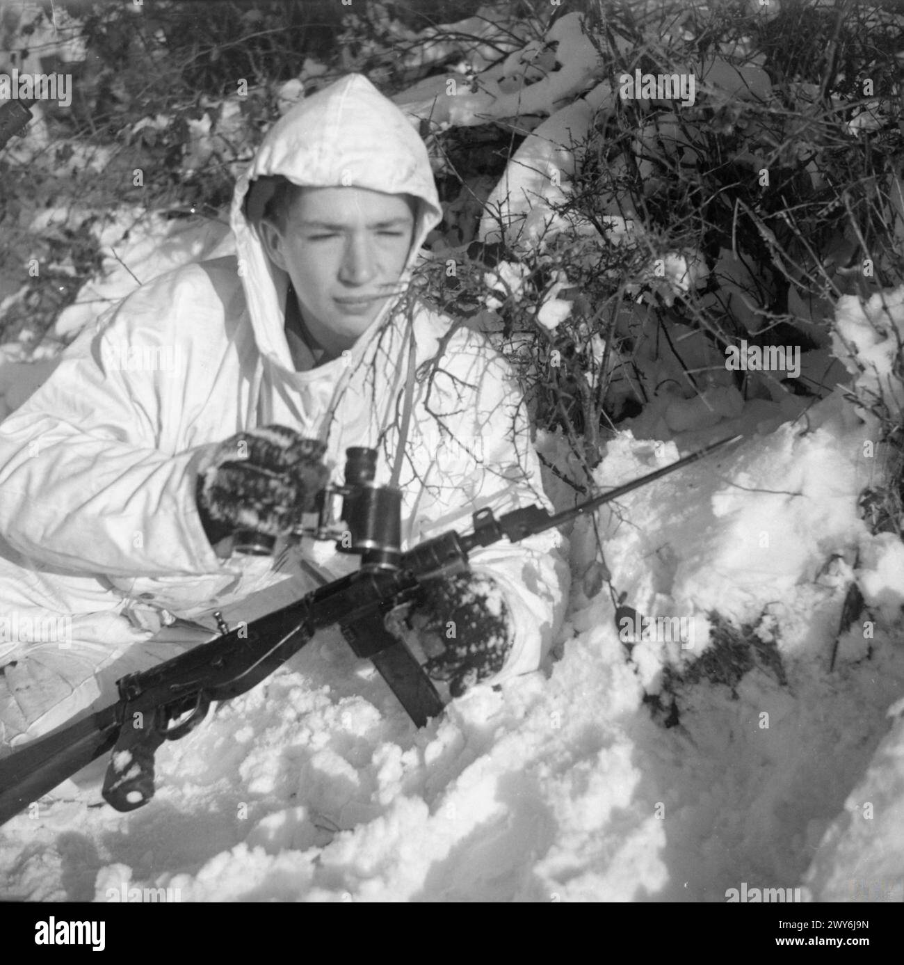 An officer of a reconnaissance patrol wears snow camouflage on 15 ...