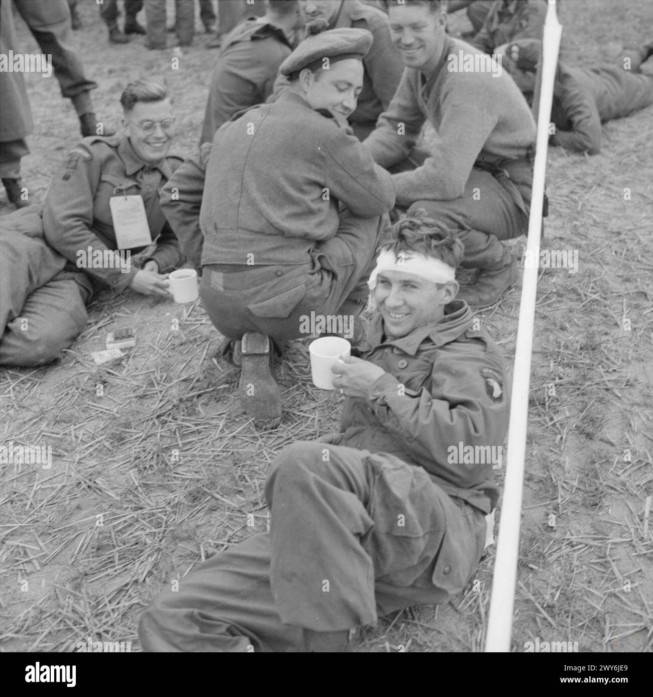 An American airborne soldier is shown having a cup of tea while ...