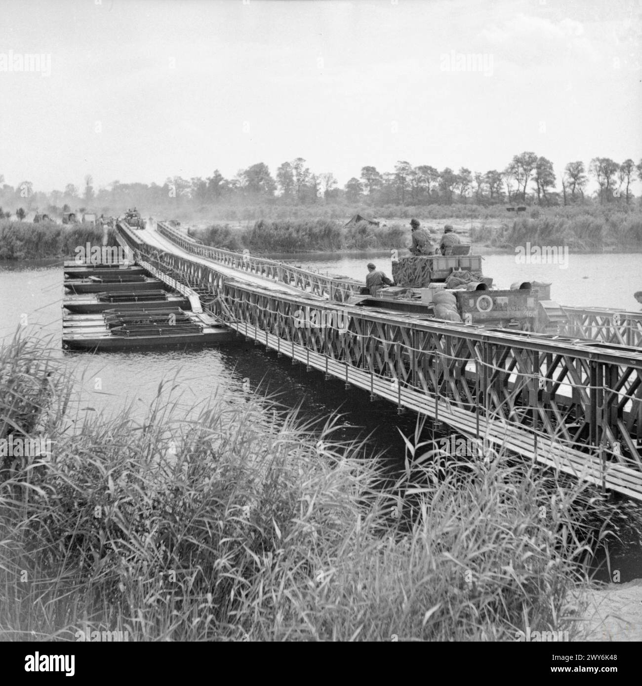 THE BRITISH ARMY IN NORMANDY 1944 - Cromwell tanks moving across 'York' bridge, a Bailey bridge over the Caen canal and the Orne river, during Operation 'Goodwood', 18 July 1944. , British Army Stock Photo