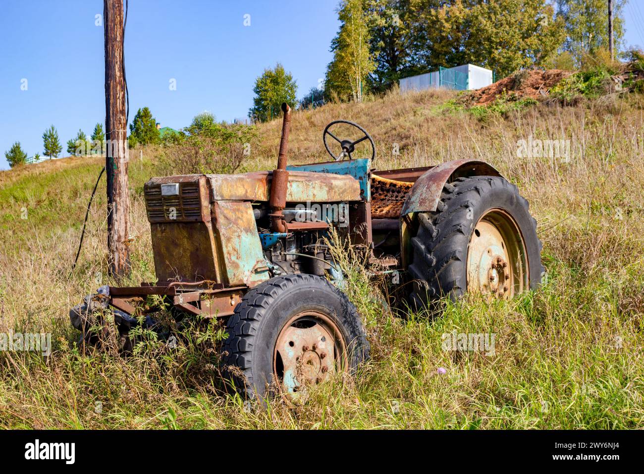 Old Soviet tractor LTZ - Lipetsk tractor plant. Farm in the countryside: Malomakhovo, Russia - September 2018 Stock Photo