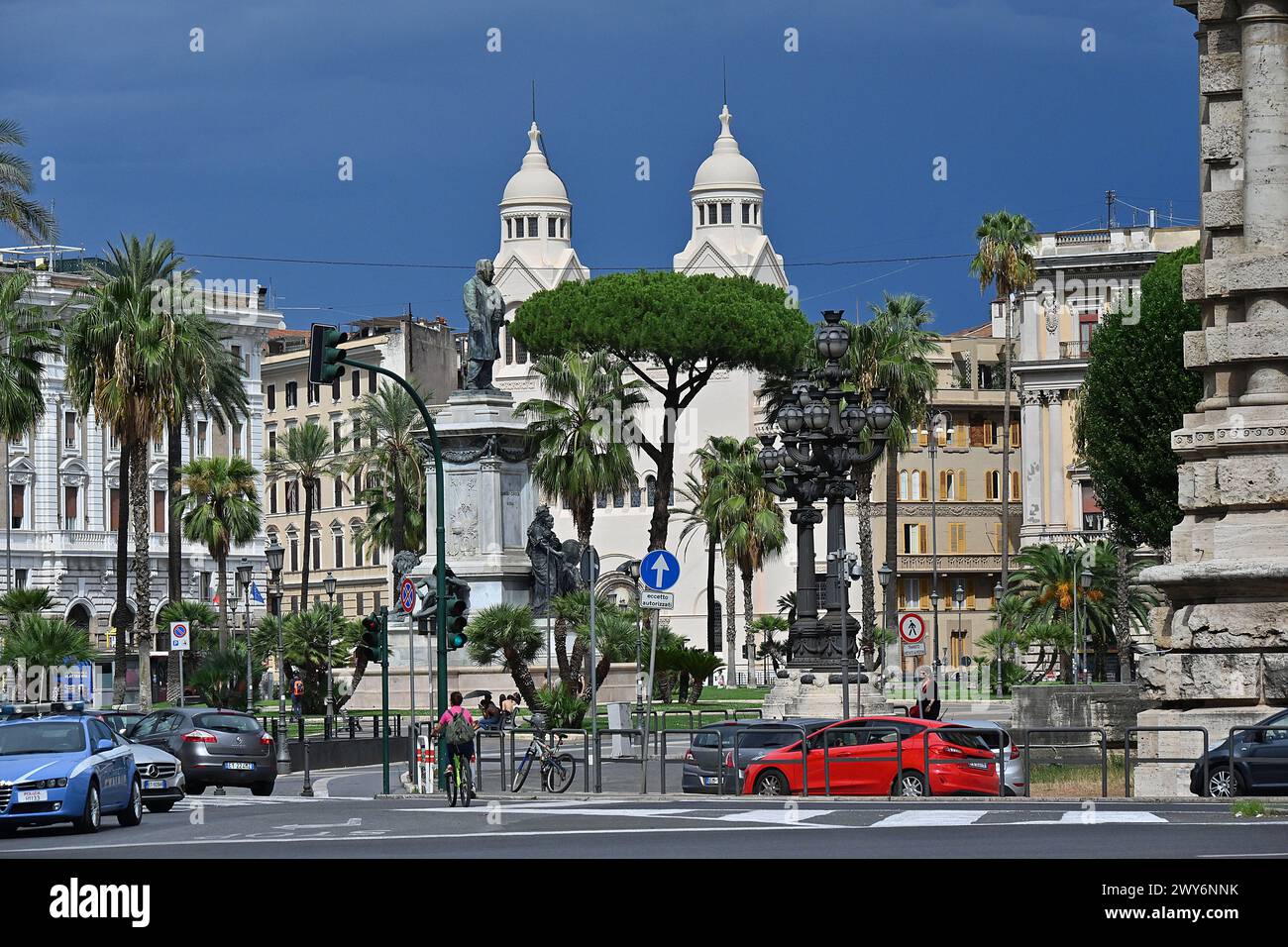 Italy, Rome: “Piazza Cavour” square in the district of Prati. Traffic near the central garden with a bronze statue of Camillo Benso, Count of Cavour. Stock Photo