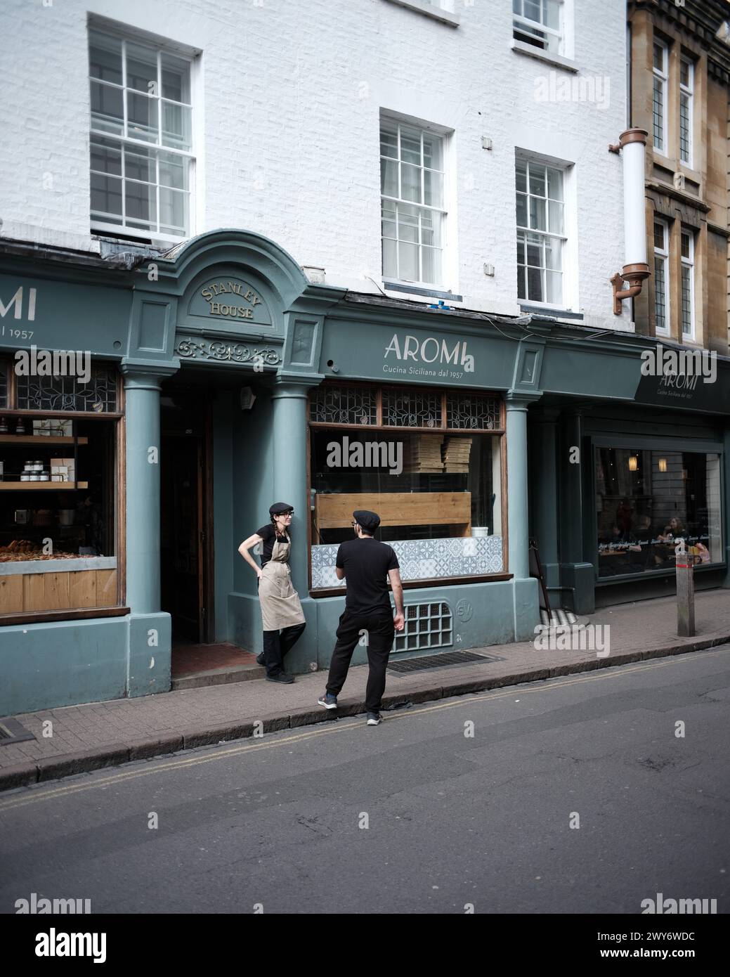 Staff outside of an Italian restaurant in Cambridge UK Stock Photo
