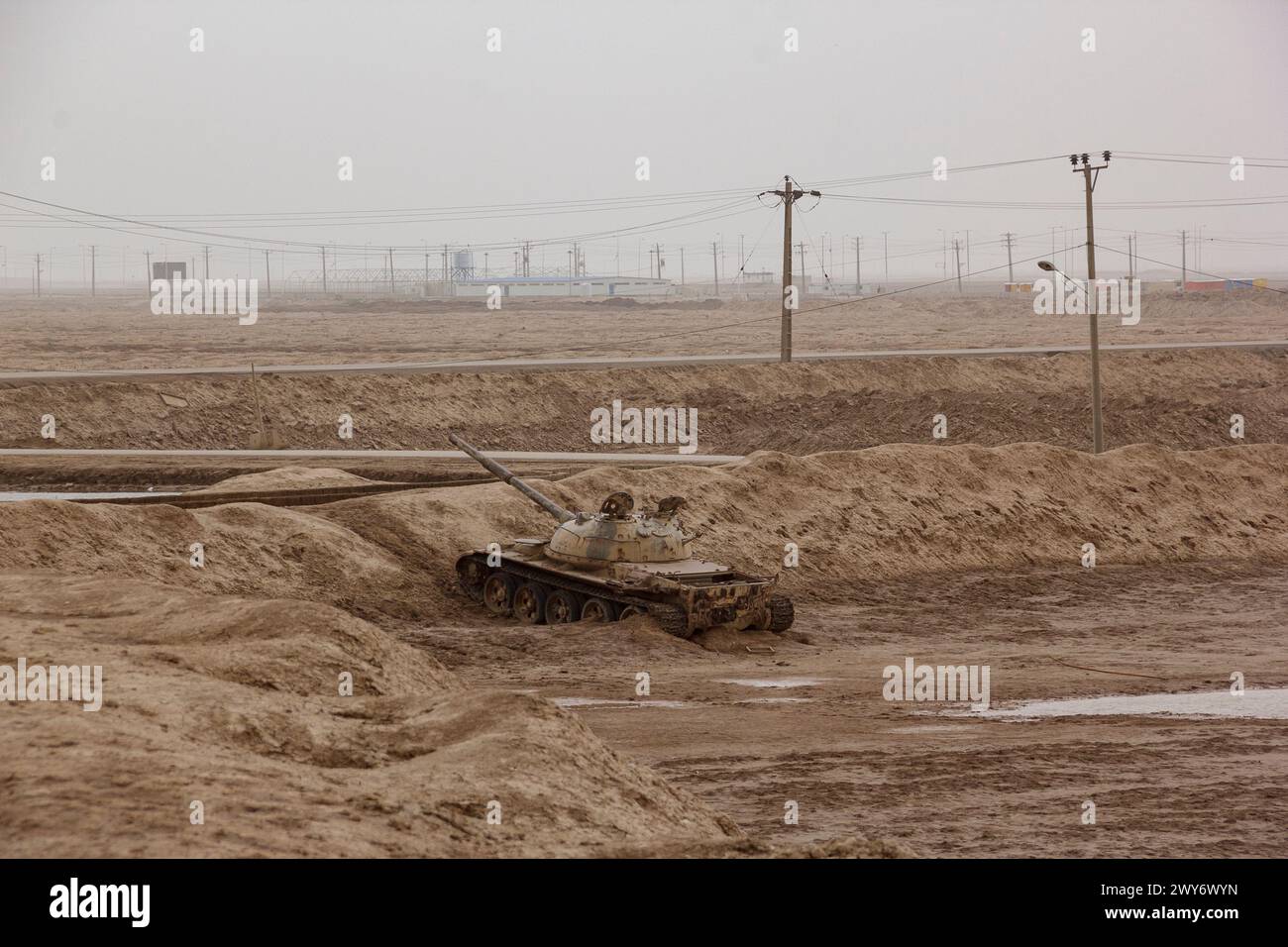 A wrecked tank that is leftover from the Iran-Iraq war in the 1980s. Here is Shalamcheh border city in Khuzestan Province in south west Iran. Stock Photo