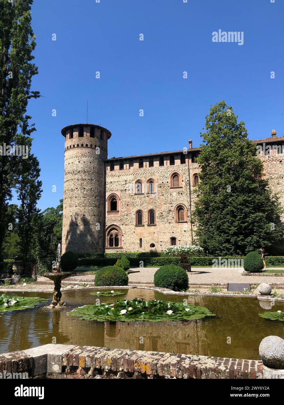 Grazzano Visconti, italy - june 11, 2023: view from the fountain of medieval castle of Visconti di Modrone in Piacenza province Stock Photo