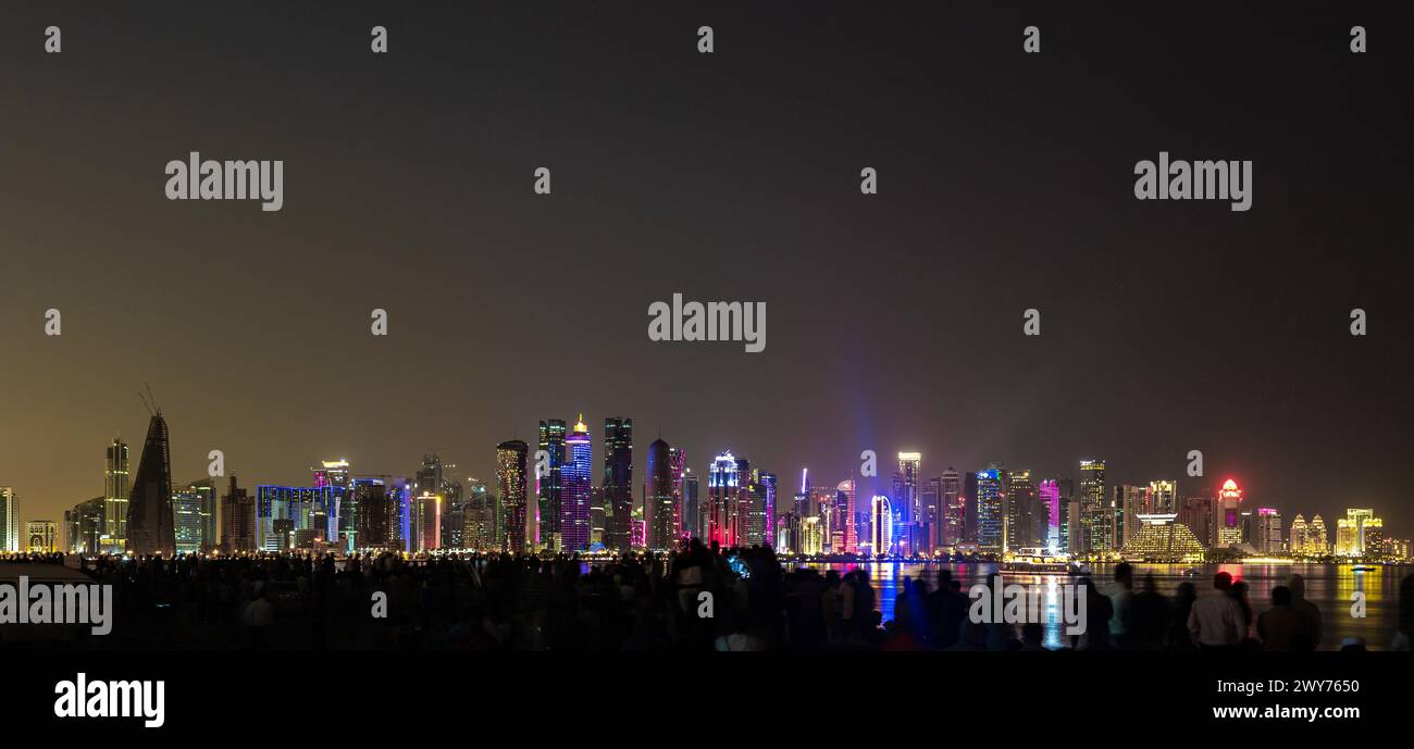 Qatar national day, The illuminated skyline of the commercial center of Doha, the capital of the Arabian Gulf country Qatar at night. Stock Photo