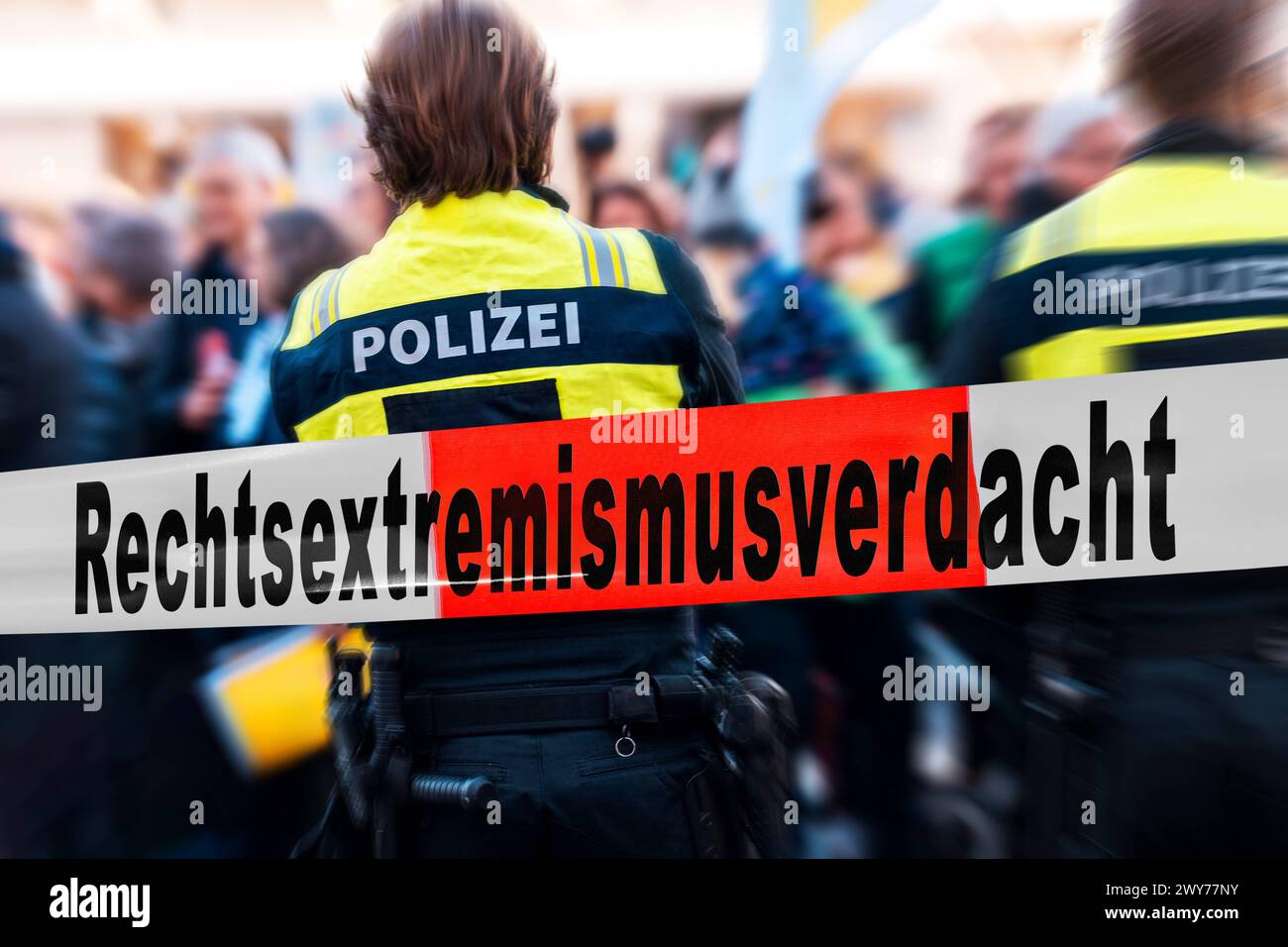 4 April 2024: Symbolic photo of right-wing extremism suspected by the police in Germany. Police officers with a barrier tape and the inscription: Right-wing extremism suspected. PHOTOMONTAGE *** Symbolfoto Rechtsextremismus-verdacht bei der Polizei in Deutschland. Polizisten mit einem Absperrband und der Aufschrift: Rechtsextremismusverdacht. FOTOMONTAGE Stock Photo