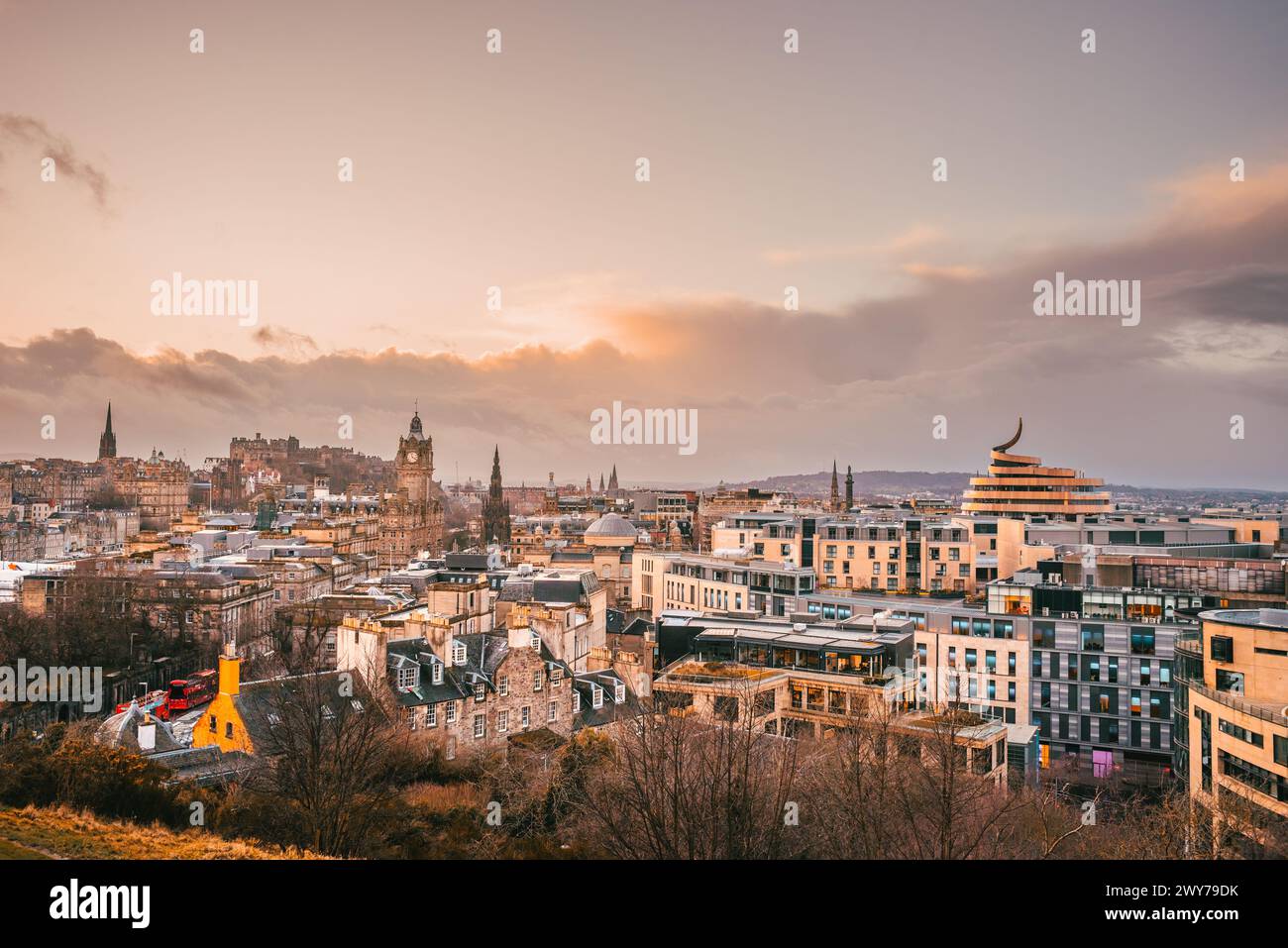A sunset view of the Edinburgh skyline from Calton Hill, with iconic buildings visible Stock Photo