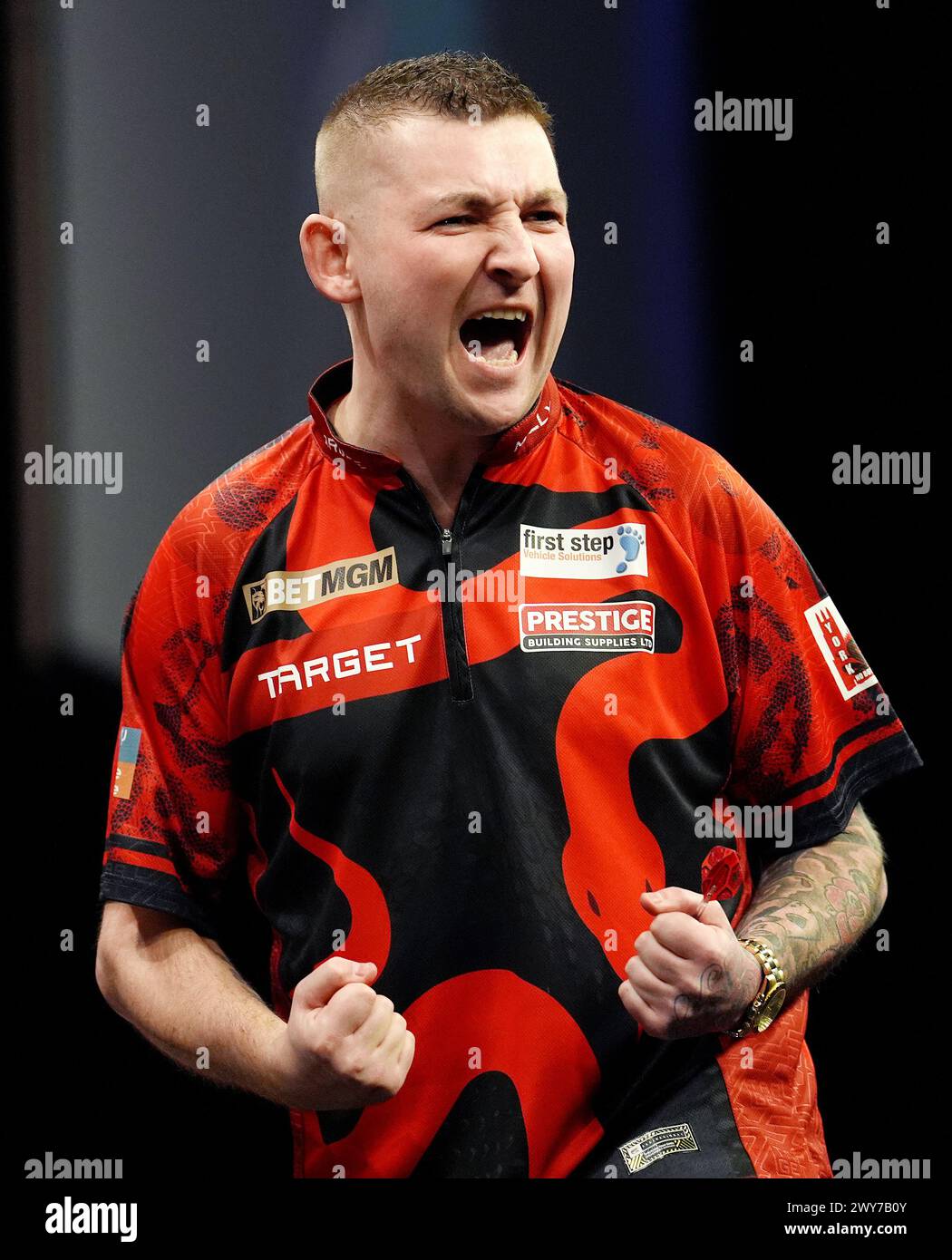Nathan Aspinall celebrates during their match against Rob Cross (not