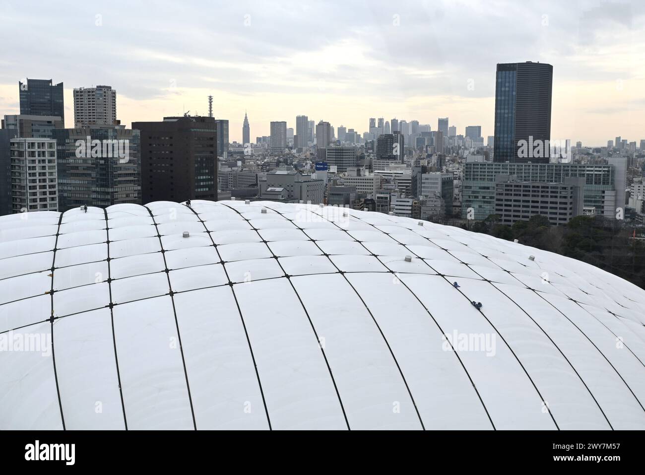 The Tokyo Dome roof with Workers on it viewed from a ferris wheel – Koraku, Bunkyo City, Tokyo, Japan – 29 February 2024 Stock Photo