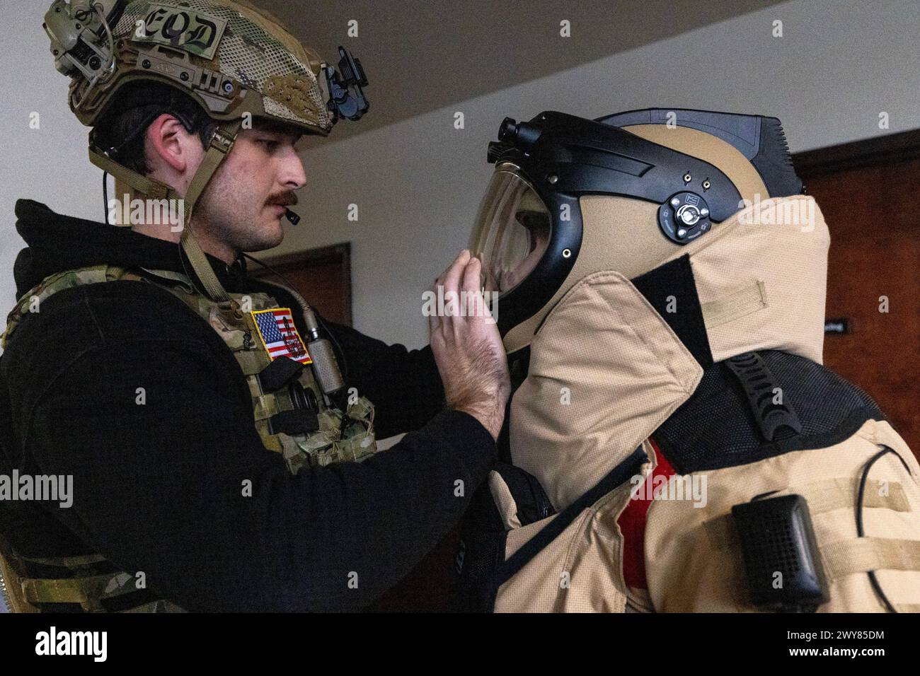 Mar 27, 2024 - Trenton, New Jersey, USA - U.S. Air Force Airman 1st Class Robert Wittig, left, closes the helmet on Senior Airman Russell J. Bongiovanni's EOD-10E bomb suit, both explosive ordnance disposal technicians with the 177th Fighter Wing, New Jersey Air National Guard, during the Joint Chemical, Biological, Radiological, Nuclear, and High Yield Explosives Characterization, Exploitation, and Mitigation Course JCCEM at the CURE Insurance Arena with FBI; New Jersey State Police, and members of the Delaware and Idaho WMD-CSTs were trained by the Eniwetok Group, LLC (EGL). (Credit Image: © Stock Photo