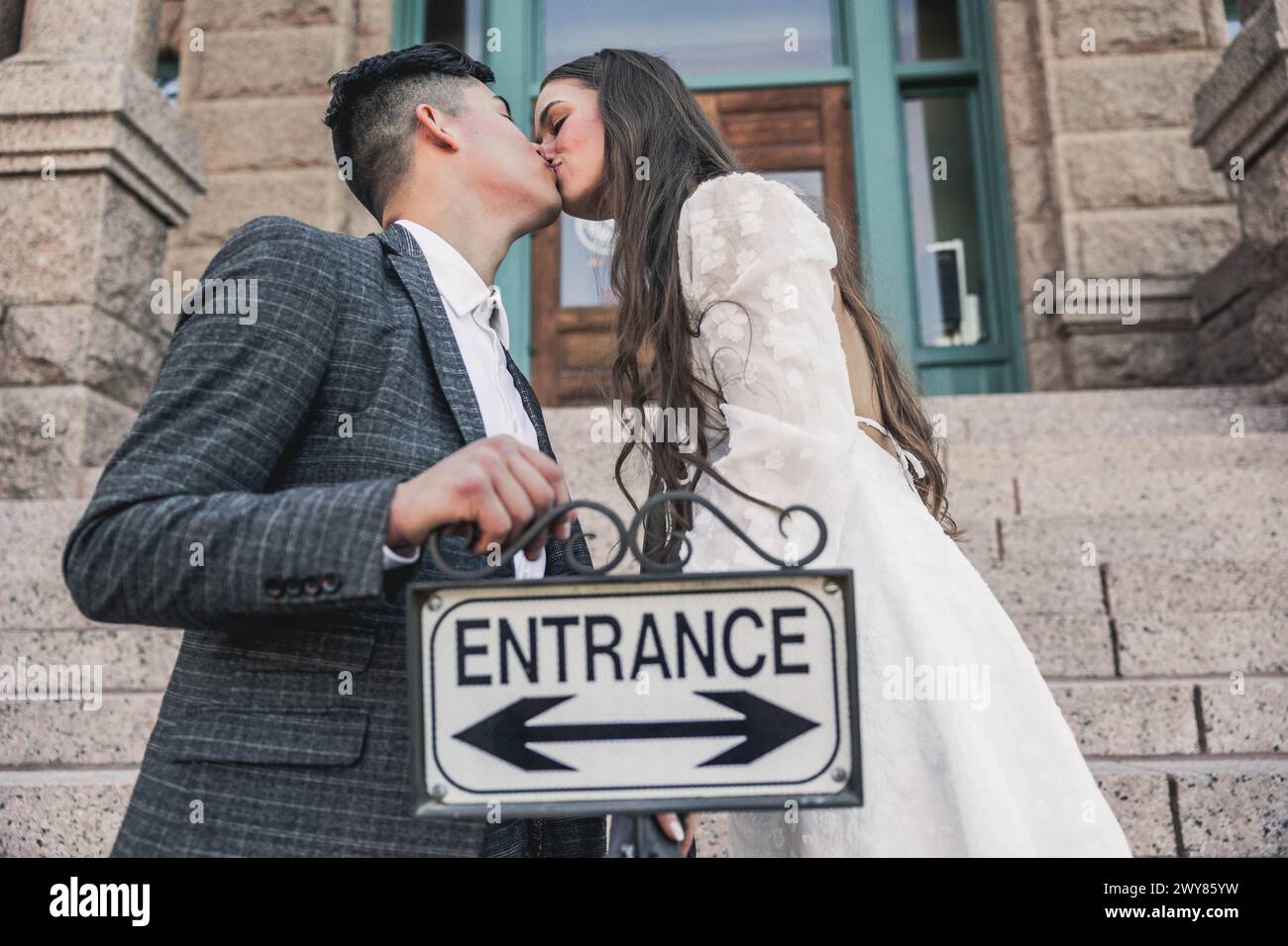 Newlyweds kiss in front hi-res stock photography and images - Alamy