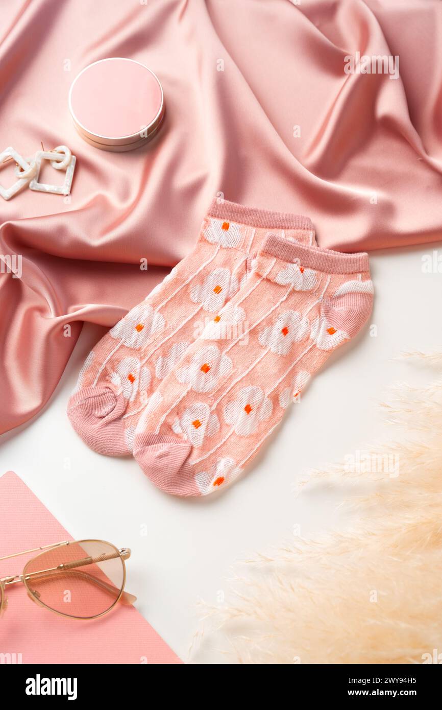 Pink socks with pattern on white background Stock Photo