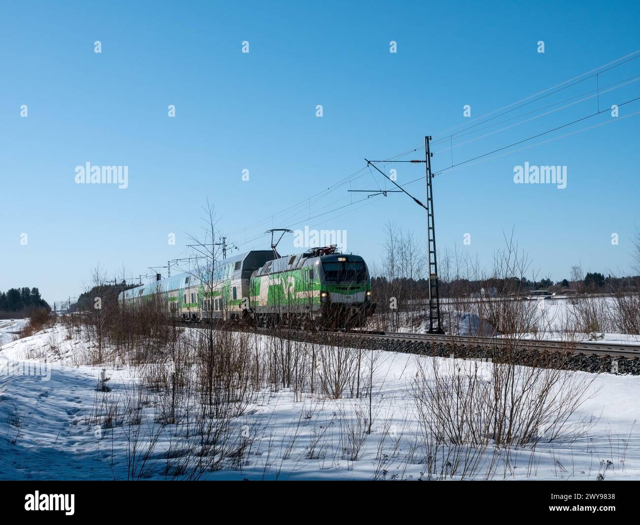 Pendolino train in early spring scene, Kempele Finland Stock Photo