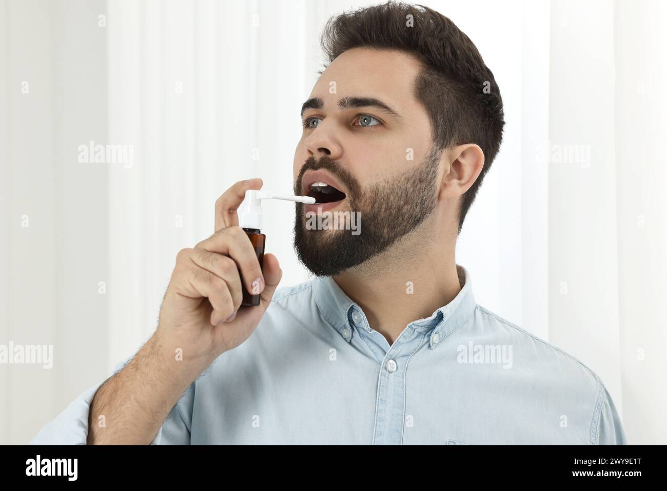 Using Mouth Spray Man using mouth spray hi-res stock photography and images - Alamy