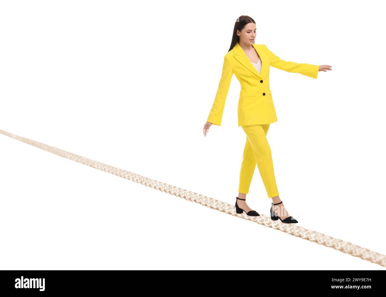 Businesswoman walking rope against white background. Risk or balance concept Stock Photo