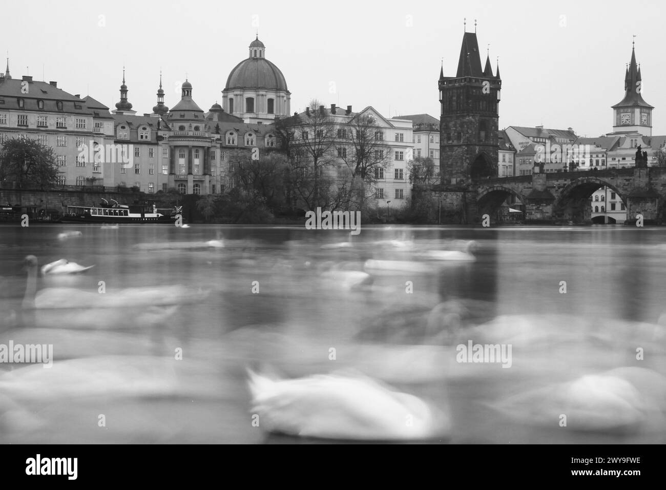 A grayscale cityscape of Prague near the Charles Bridge, Czech Republic. Stock Photo