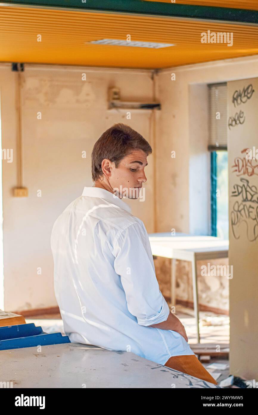 young man in an abbandoned factory Stock Photo