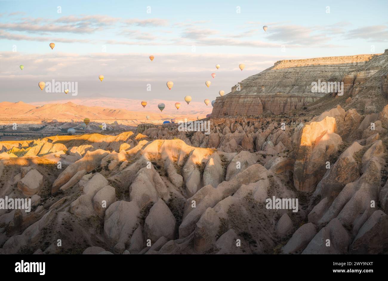 Cappadocia Sunrise with Hot Air Balloons over Volcanic Valley Stock ...