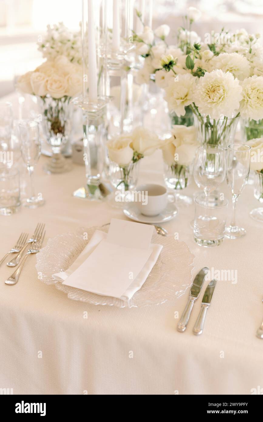 Refined wedding table setting in all white Stock Photo