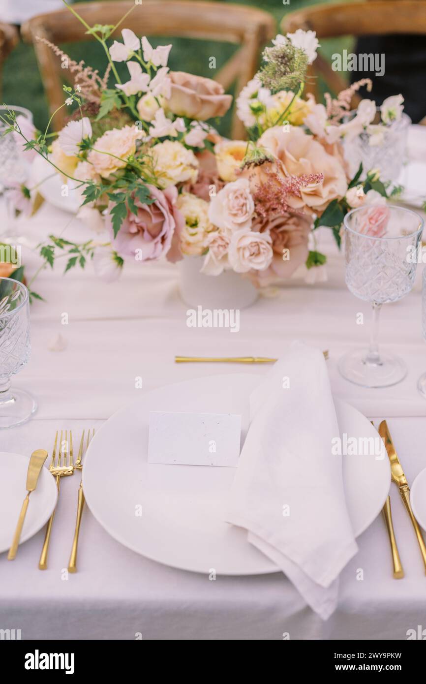 Elegant wedding place setting with gold accents Stock Photo