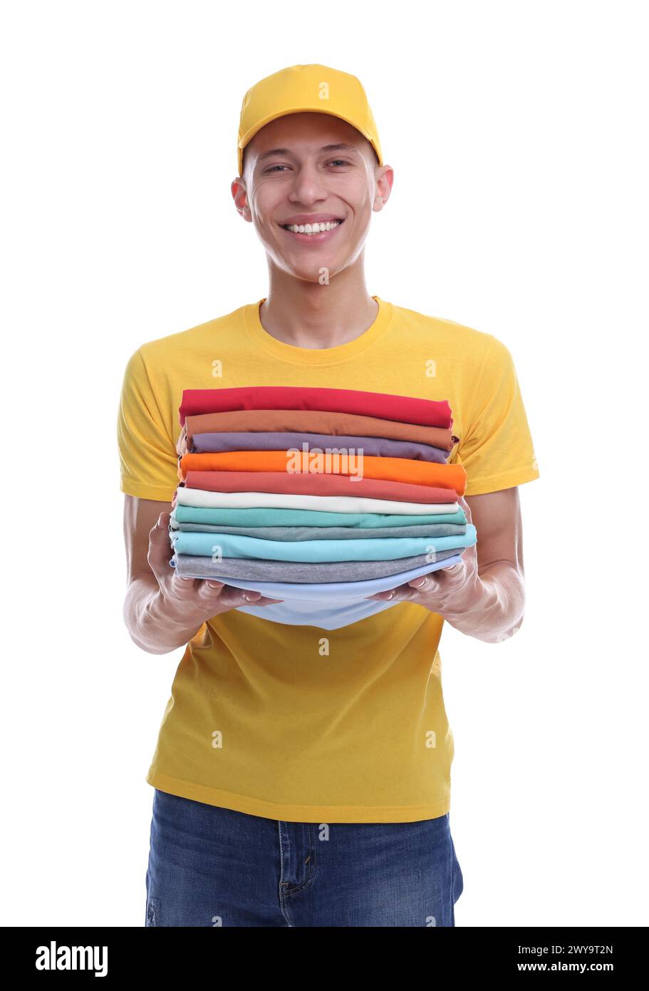 Dry-cleaning delivery. Happy courier holding folded clothes on white ...