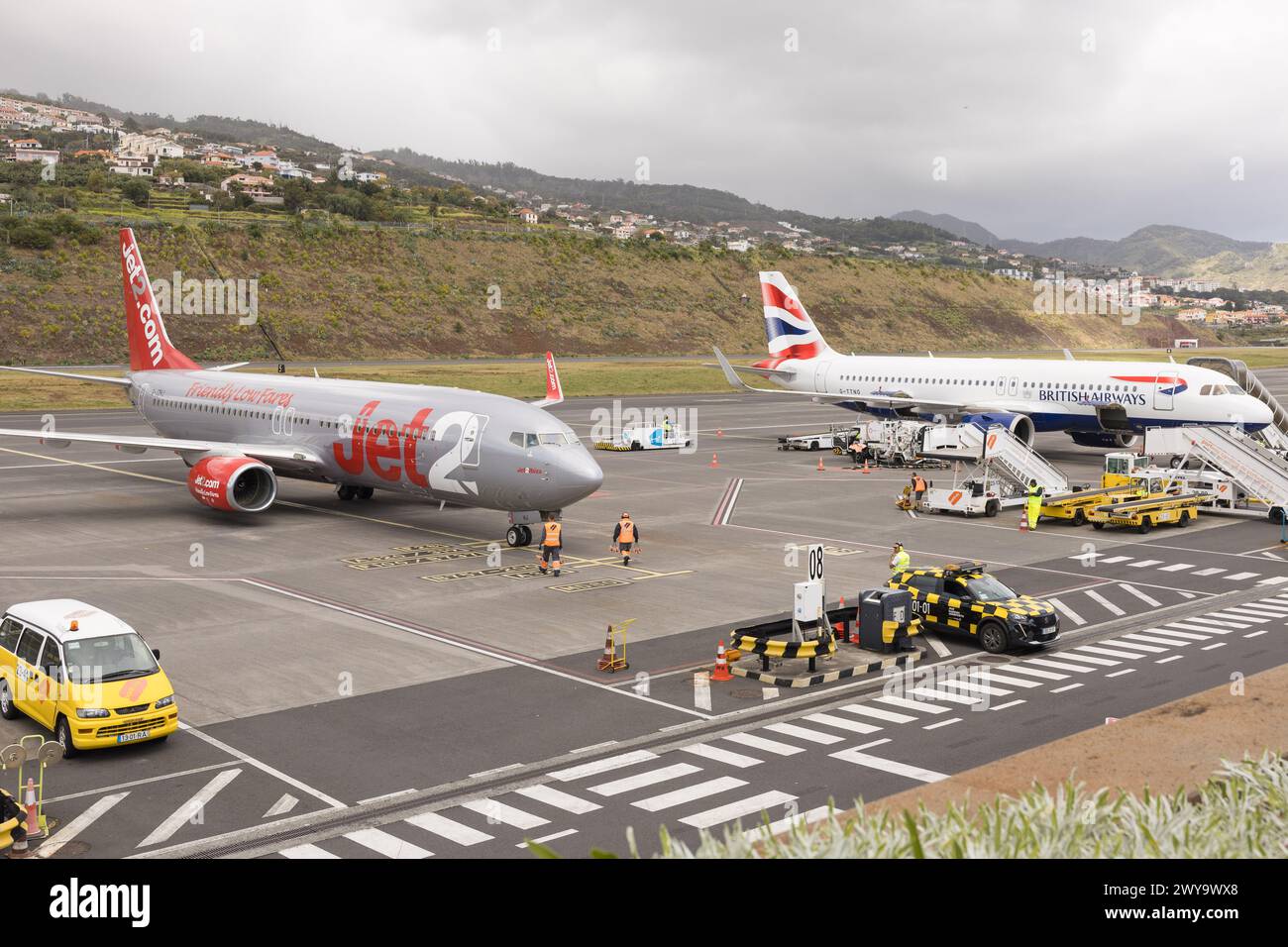 Jet 2 and British Airways passenger aircraft aeroplanes parked at Cristiano Ronaldo International Airport, Funchal, Madeira. Stock Photo