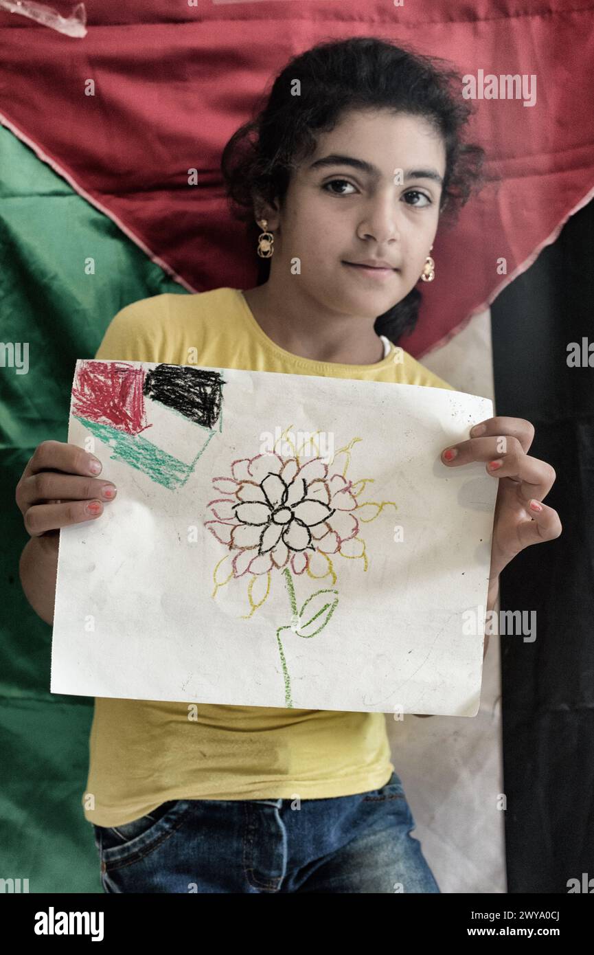 Palestinian kids from school showing their vision of Palestine during a drawing exercice. Sabra-shatila refugee camp in Lebanon Stock Photo