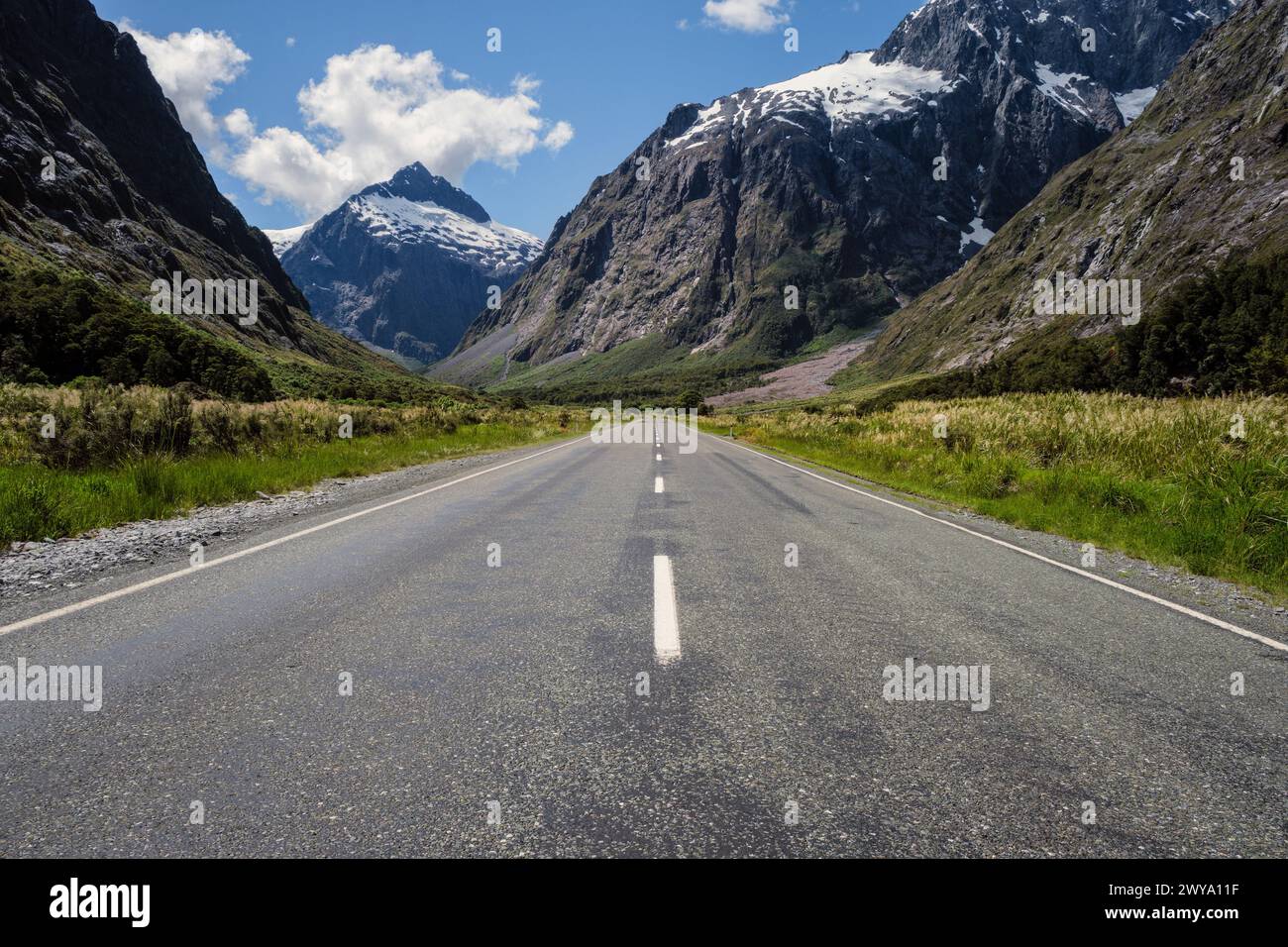 The Milford Sound Highway at Monkey Creek looking towards Mount Talbot in the distance, Fiordland National Park, Southland, South Island, New Zealand Stock Photo