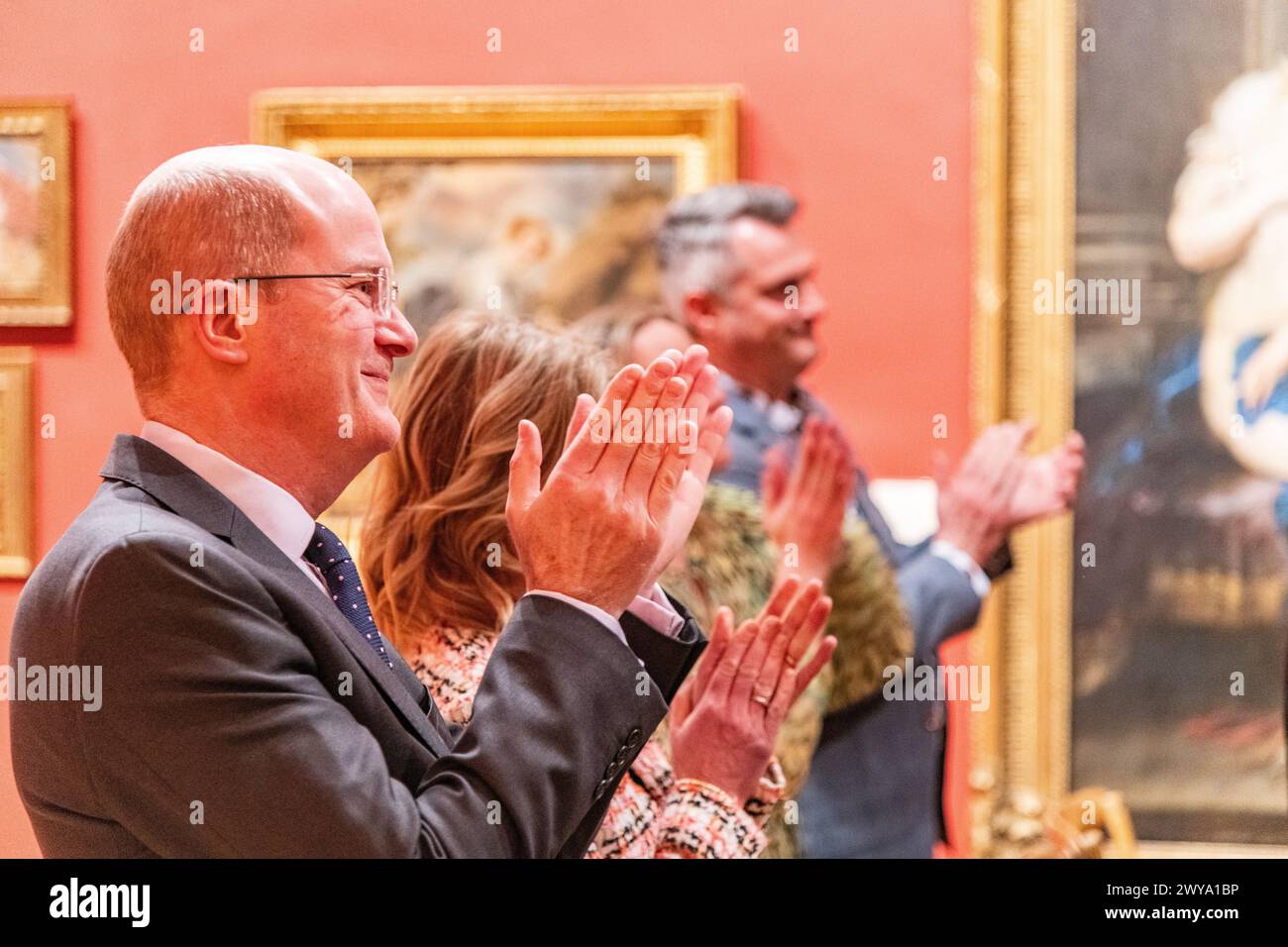 Wedding guests clapping and celebrating during a wedding ceremony at Dulwich Picture Gallery in London, UK Stock Photo