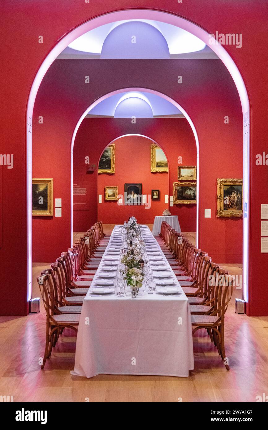 An empty dinner table with no people laid out at a wedding at Dulwich Picture Gallery in London, UK Stock Photo