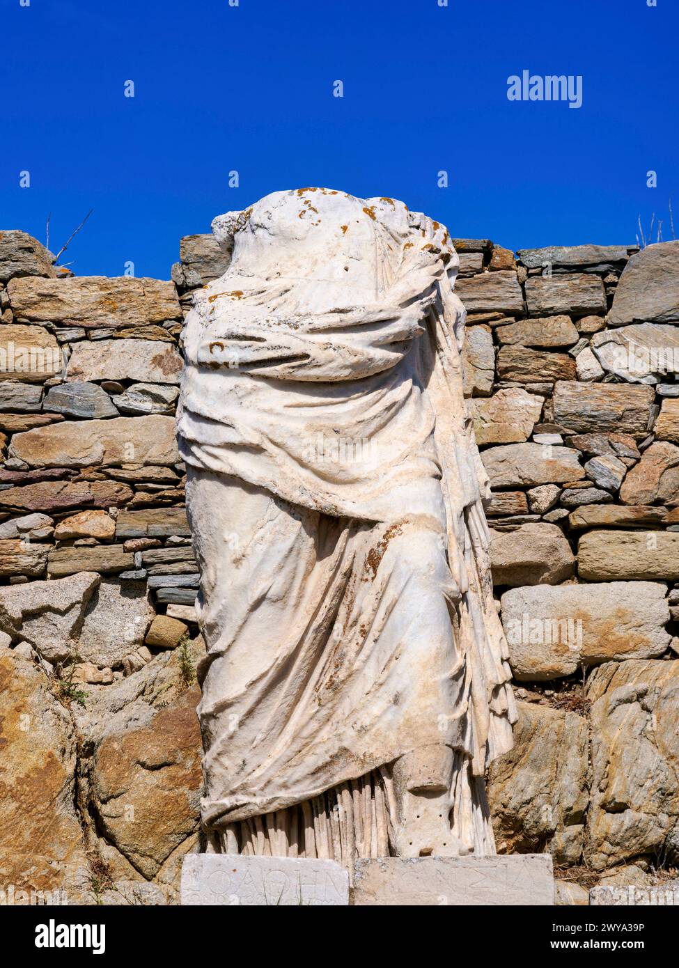 Headless Statue at the Temple of Isis, Delos Archaeological Site, UNESCO World Heritage Site, Delos Island, Cyclades, Greek Islands, Greece, Europe Co Stock Photo